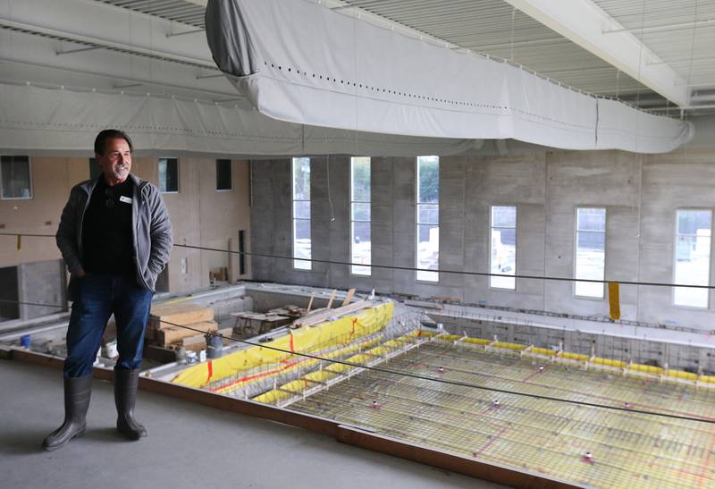 Ottawa YMCA executive director Joe Capece smiles as he stands above the competitive indoor pool while giving a private tour of the new YMCA building on Thursday, Oct. 19, 2023 in Ottawa. Construction on the $25.7 million, 67,000-square-foot riverfront YMCA began a year ago and is expected to be open late spring of 2024.