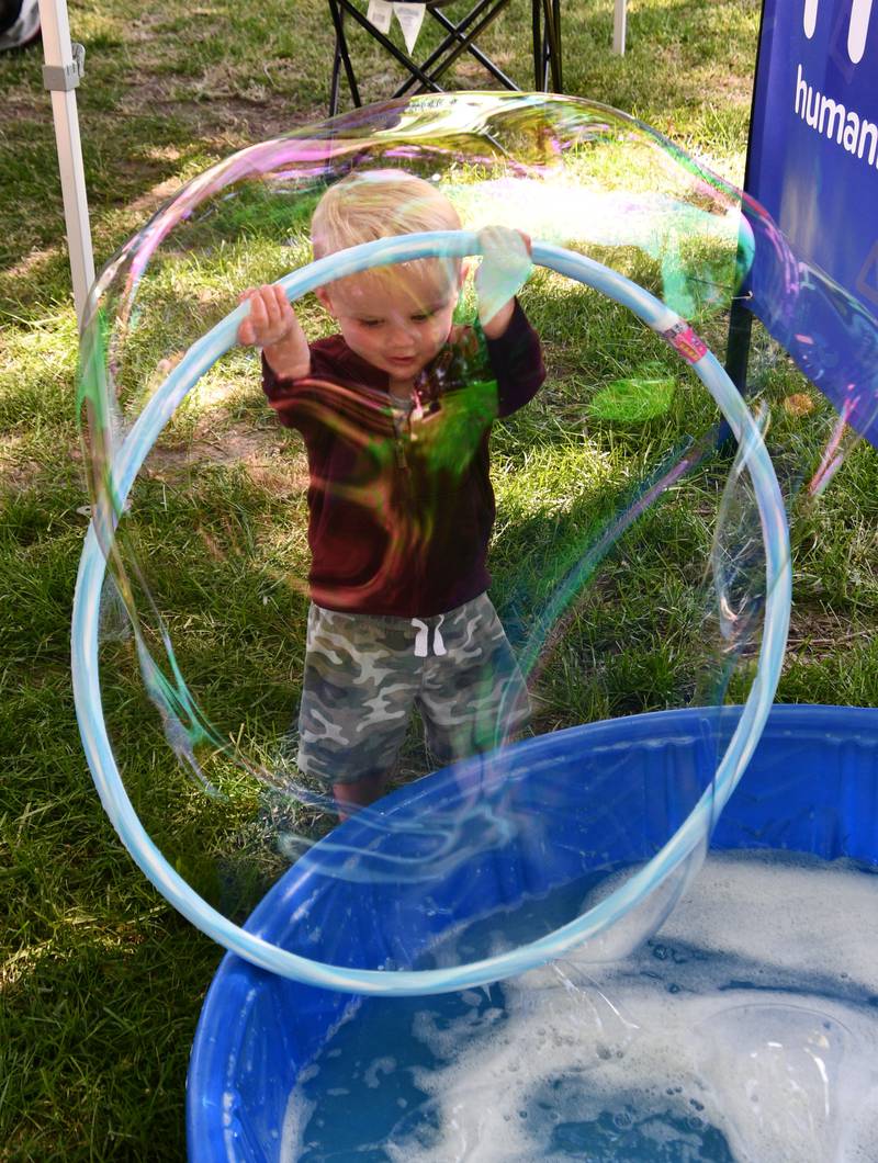 Tommy Tracey plays with bubbles Saturday, May 27, 2023, during Sidewalk Chalkapalooza at Soldiers and Sailors Park in Princeton.