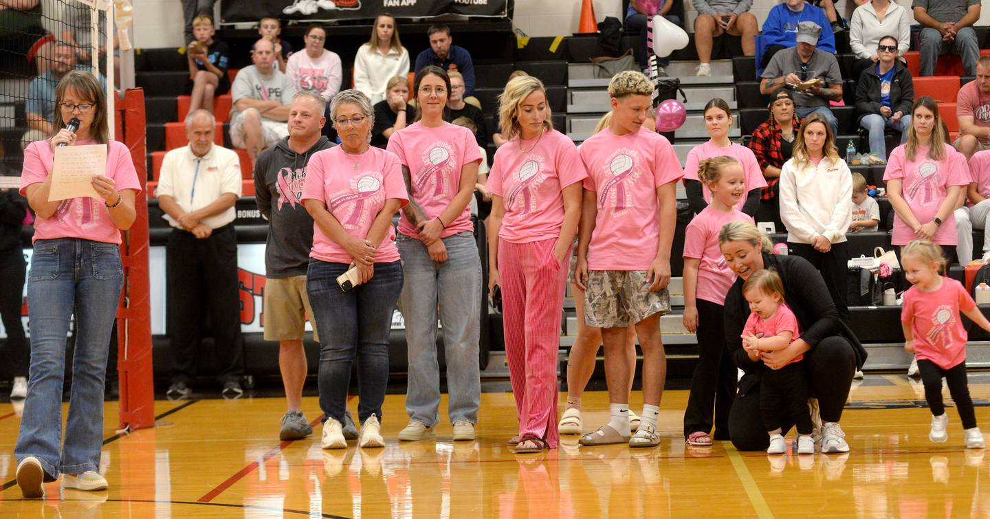 Fulton High School volleyball coach Stacy Germann (far left) announced that proceeds from the Volley for the Cure event on Tuesday, Oct. 7, 2025 would benefit Rene Sanquist and her family. Rene (third from left)  is facing breast cancer. Germann said Rene is the mother of Paige, Liz, and Morgan, all of whom have grown through the Steamer volleyball program.
