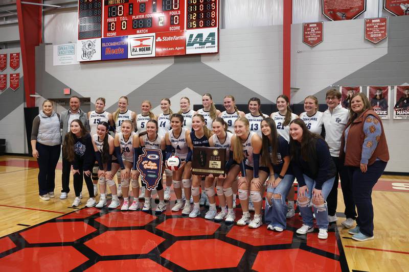 Cissna Park players pose with the IHSA Class 1A Heyworth Super-Sectional plaque following Timberwolves' victory in two sets, 25-22, 25-11, over Windsor/Stewardson-Strasburg on Monday, Nov. 10, 2025.