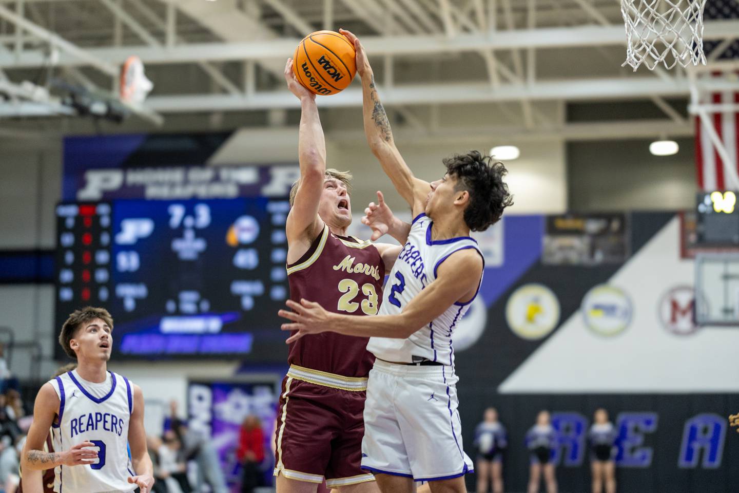 Morris' Jack Wheeler (23) shoots the ball over the defense of Plano's Gabe Steele (2) during Friday's game in Plano.