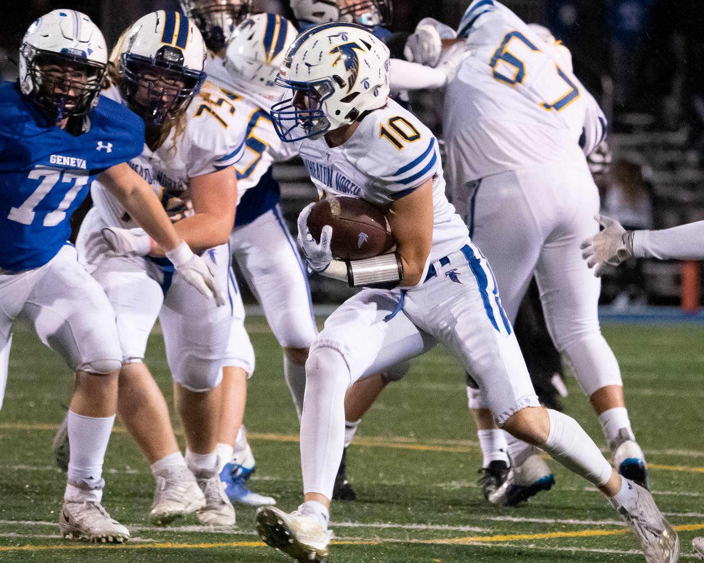 Wheaton North’s Tyler O'connor (10) carries the ball against Geneva during a football game at Geneva High School on Friday, Oct 14, 2022.