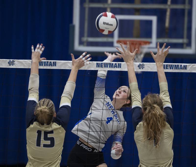 Newman’s Ruby Burger goes for the hit against Mercer County Wednesday, Sept. 24, 2025.