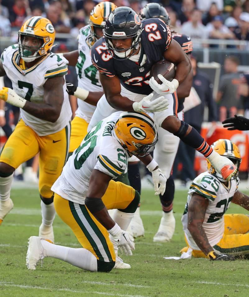 Chicago Bears guard Lucas Patrick hoists wide receiver Darnell Mooney after he caught a touchdown pass during their game Sunday, Sept. 10, 2023, at Soldier Field in Chicago.