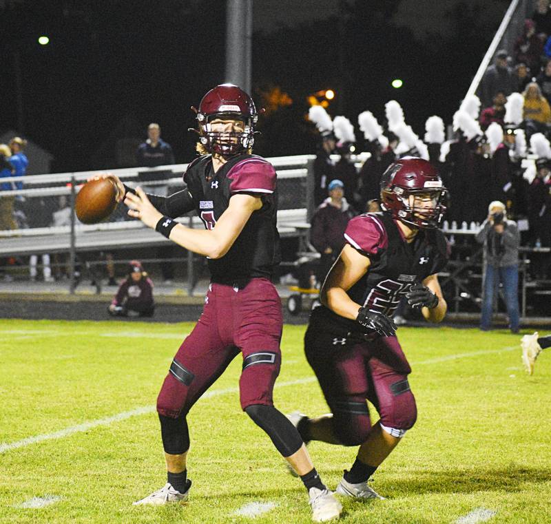 Marengo quarterback Josh Holst looks to throw as running back Joseph Leibrandt eyes a blocker.