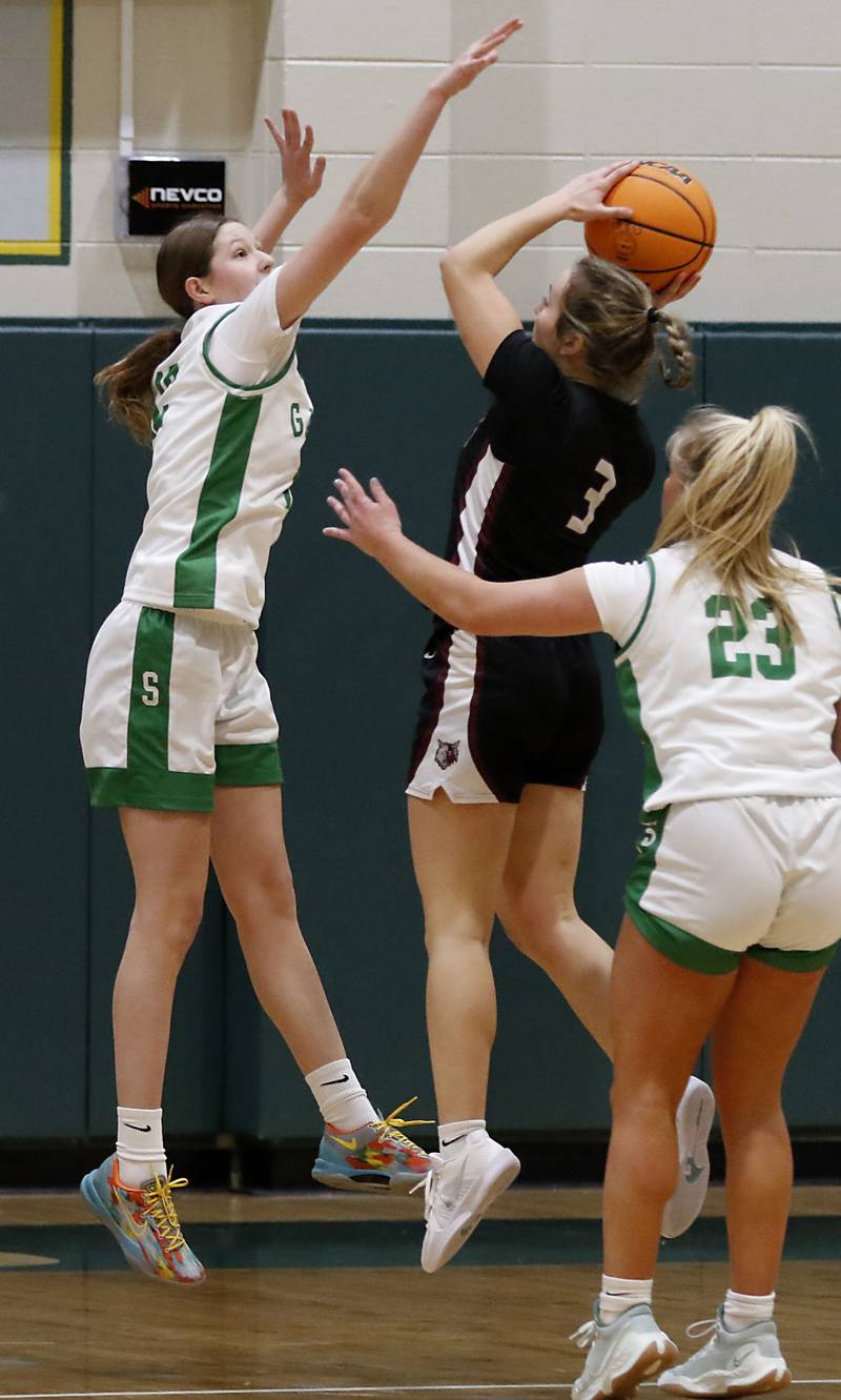 Crystal Lake South's Gaby Dzik tries to block the shot of Prairie Ridge's Zoe Nanos during a Fox Valley Conference girls basketball game on Friday, Dec. 13, 2024, at Crystal Lake South High School.
