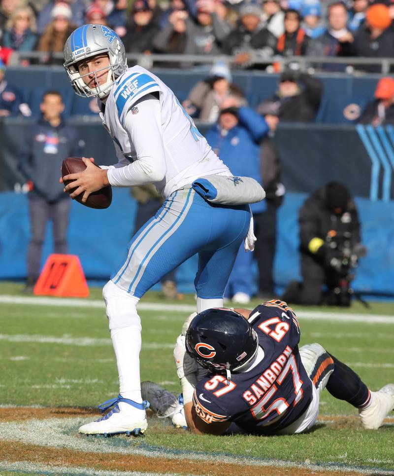 Chicago Bears linebacker Jack Sanborn tries to sack Lions quarterback Jared Goff during their game Sunday, Nov. 13, 2022, at Soldier Field in Chicago.