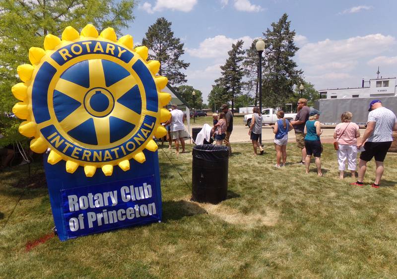 Festival goers wait in line Saturday, June 3, 2023, for fried and grilled shrimp boats during the Shrimp and Brew Hullabaloo at Rotary Park in Princeton. The Rotary Club of Princeton sponsored the event.