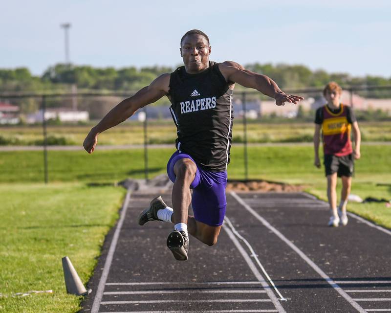 Waleed Johnson of Plano competes in the triple jump during the Kishwaukee River Conference track meet on Tuesday May 7, 2024, held at Plano High School.