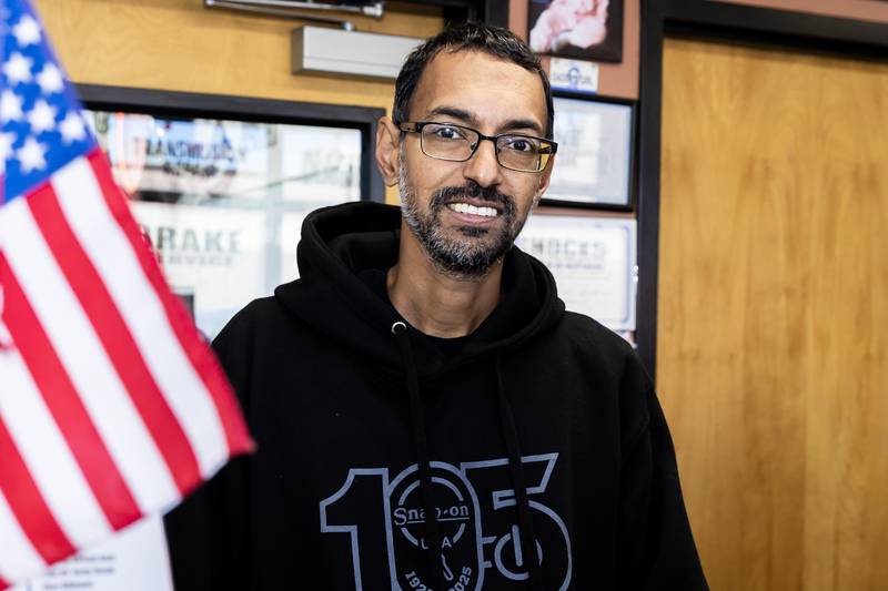 Crest Hill business owner Reza Jaddi, who supports veterans anyway he can, poses for a photo in Reza’s Auto Repair in Crest Hill on Oct. 9, 2025.