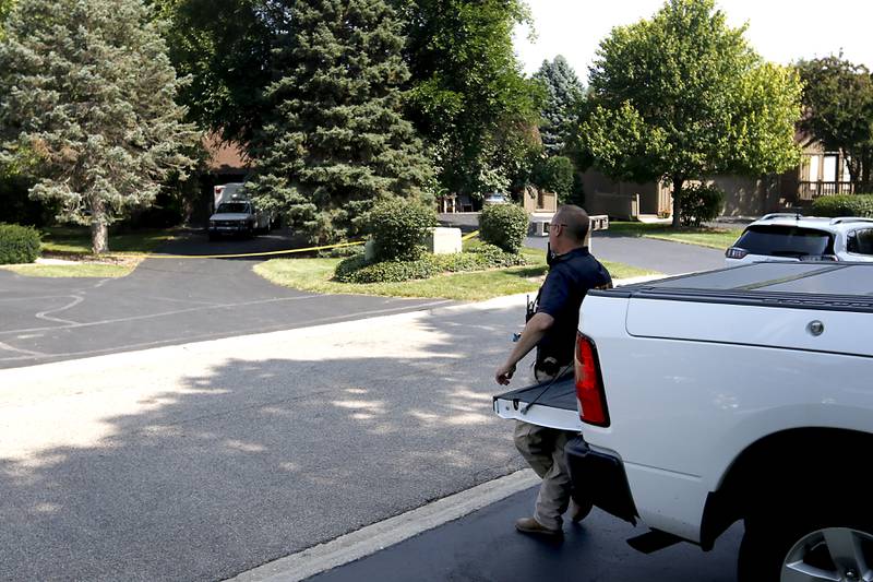 A McHenry County Sheriff's department officer outside the home in 5800 block of Wild Plum Road in unincorporated Crystal Lake on Thursday, Aug. 10, 2023, as officials continued to investigate the scene where four family members, including three females and a male “aggressor,” were killed Wednesday.