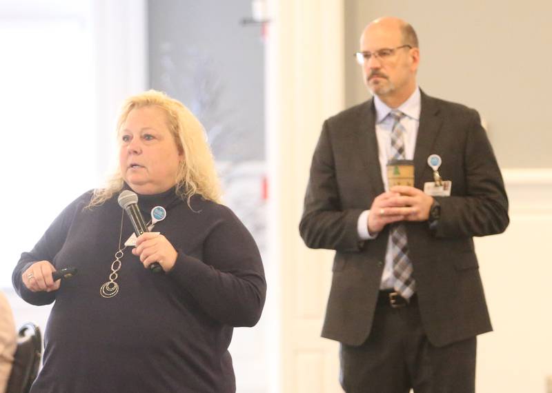 Dawn Trompeter, president of OSF Saint Elizabeth Medical Center (left), and A.J. Querciagrossa, CEO of the Western Region of OSF HealthCare, deliver a speech during the OSF Community Breakfast Regional Update on Tuesday, Nov. 28, 2023, at Senica's Oak Ridge in La Salle.