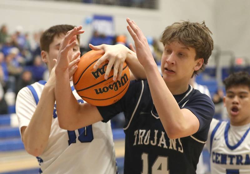 Burlington Central's Colton O'Neil battles with Cary-Grove's Evan Bauer during a Fox Valley Conference boys basketball game on Friday, February. 6, 2026, at Burlington Central High School.