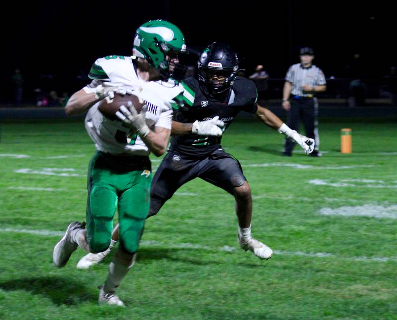 Rock Falls' Baraka Boards (11) gives chase to bring down North Boone receiver Will Doetch (5) on Friday.