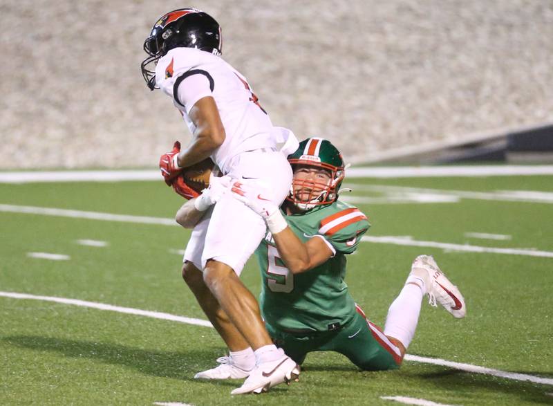 L-P's Regan Doerr brings down Metamora's Kylan McMillen on Friday, Sept. 5, 2025 at Howard Fellows Stadium.