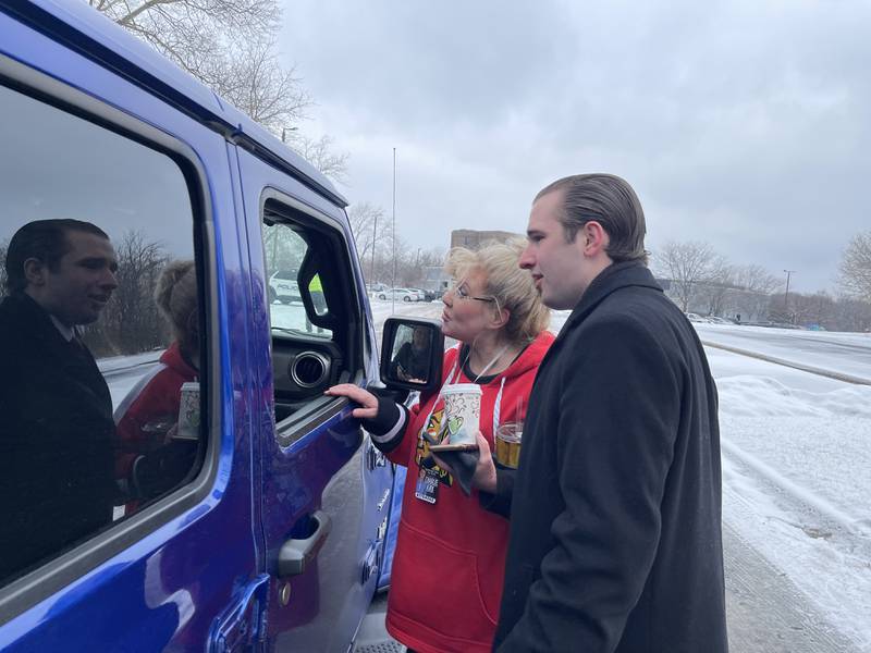 Karen Tirio (left) and Brett Corrigan check for tickets to a speaking event on Saturday, Feb. 25, 2023, outside of the Holiday Inn in Crystal Lake. The event featured conservative activist Charlie Kirk and drew protesters.