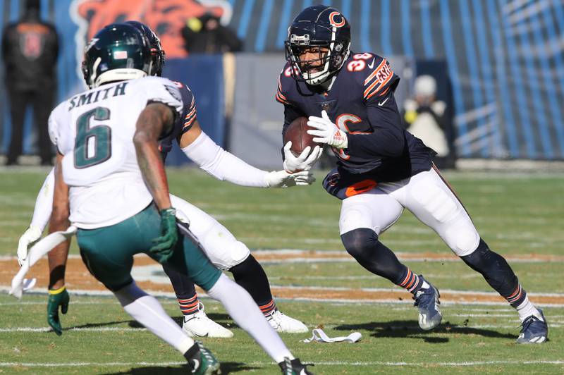 Chicago Bears safety DeAndre Houston-Carson returns an interception of Philadelphia Eagles quarterback Jalen Hurts pass during their game Sunday, Dec. 18, 2022, at Soldier Field in Chicago.