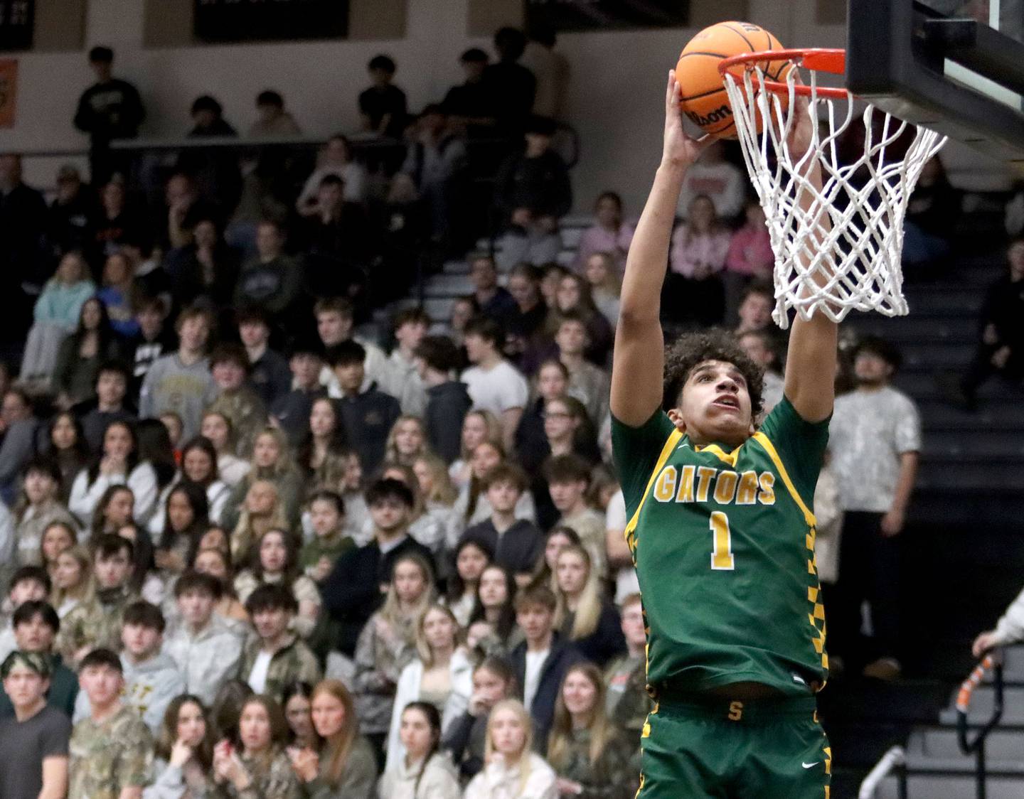 Crystal Lake South’s Noah Cook glides in for a dunk in varsity boys basketball on Friday, Feb. 20, 2026, at McHenry High School in McHenry.
