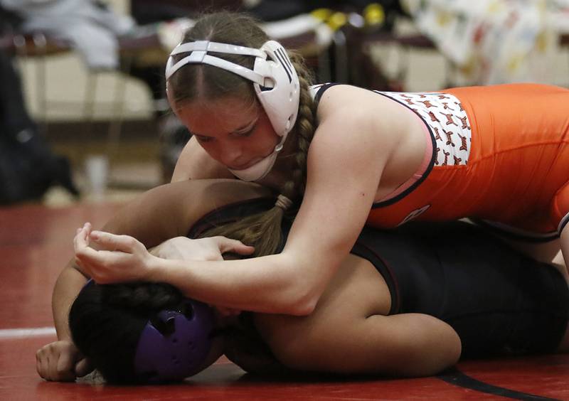 DeKalb’s Lana Zimmermantries to turn Morris’ Dulce Xique in the 135-pound match of a nononference wrestling meet on Wednesday, Jan. 22, 2025, at Huntley High School.