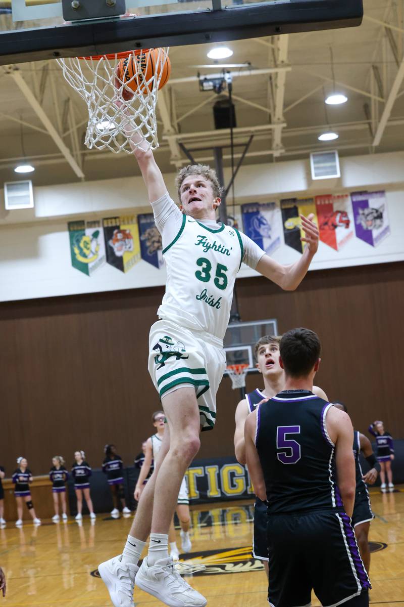 Bishop McNamara's Richard Darr floats to the hoop during the Fightin' Irish's 66-52 victory over El Paso-Gridley in the IHSA Class 2A Herscher Regional championship on Friday, Feb. 27, 2026.