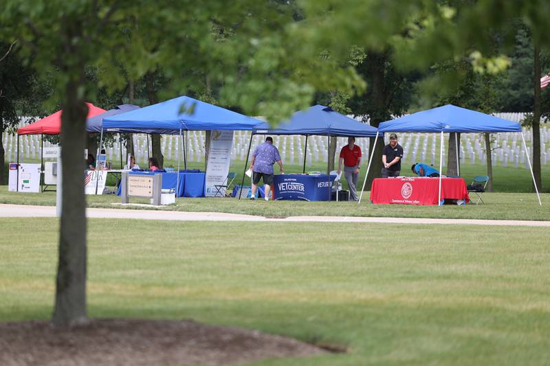 Veteran Affairs organizations set up tents to promote services and benefits at the National Cemetery Administration 50th Anniversary ceremony at the Abraham Lincoln National Cemetery in Elwood on Saturday, July 29.