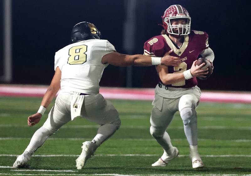 Morris' Carter Button tries to avoid being sacked by Sycamore's Diego Garcia during their game Friday, Oct. 20, 2023, at Morris High School.