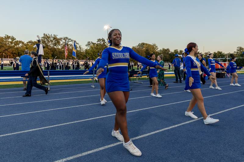 Joliet Central’s varsity cheer team hypes up the crowd before a home football game against Plainfield Central on Sept. 26, 2025.