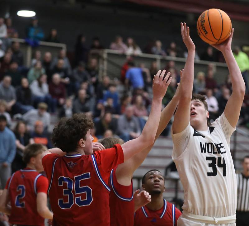 Prairie Ridge's Tiago Gray shoots th ball over Dundee-Crown's Hudson Reardon during a Fox Valley Conference boys basketball game on Friday, Jan. 16, 2026, at Prairie Ridge High School in Crystal Lake.