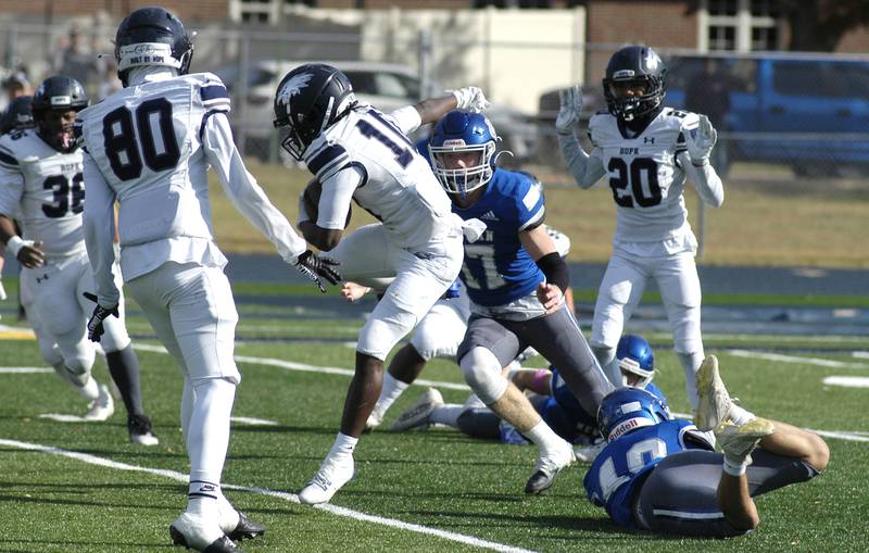 Newman player George J ungerman prepares to take down Chicago Hope's Jayden Rush.   Newman defeated Chicago Hope 50-22 in Class 1A 1st round football at Sterling High School on Saturday, November 2, 2024.