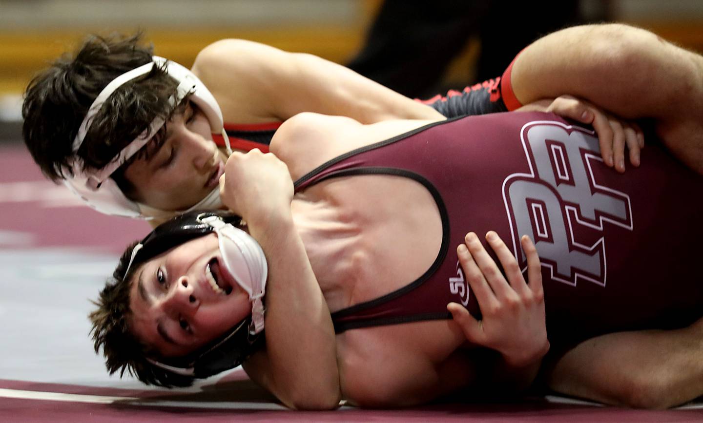 Huntley’s Cam Abordo pins Prairie Ridge’s Lorenzo Massart during the 132-pound match of a Fox Valley Conference boys wrestling meet on Thursday, Jan. 22, 2026, at Prairie Ridge High School Crystal Lake.