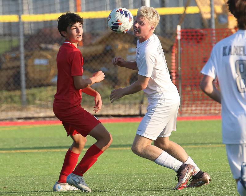 L-P's Adrian Gonalez and Kaneland's Sam Keen miss a header as the ball gets past them on Monday, Aug. 28, 2023 at the L-P Athletic Complex in La Salle