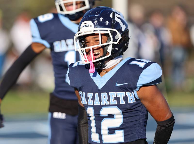 Nazareth's Edward Mcclain Jr. (12) celebrates a touchdown against St. Francis during the boys varsity IHSA 5A semifinal between Nazareth Academy and St. Francis high school in La Grange Park, IL on Saturday, Nov. 18, 2023.