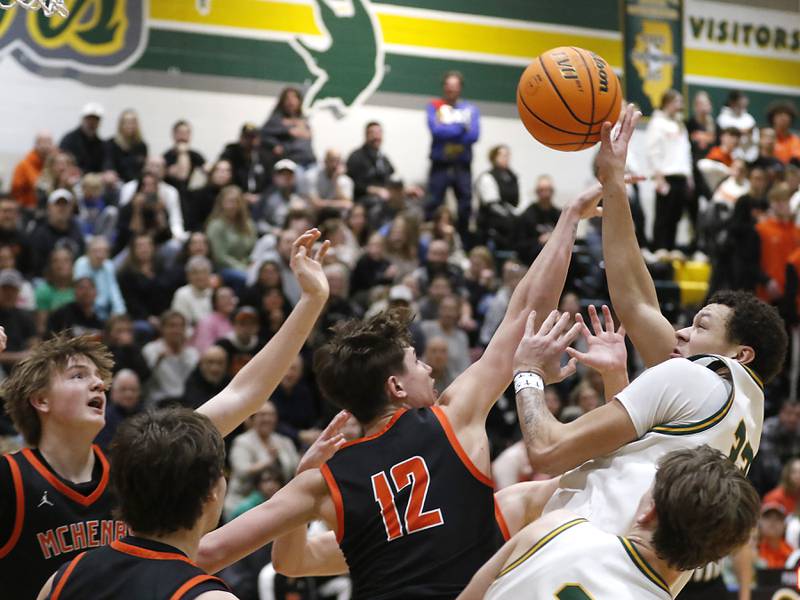 Crystal Lake South's Cooper Buelna shoots the ball over McHenry's Caleb Jett during a Fox Valley Conference basketball game on Friday, Jan. 31, 2025, at Crystal Lake South High School.
