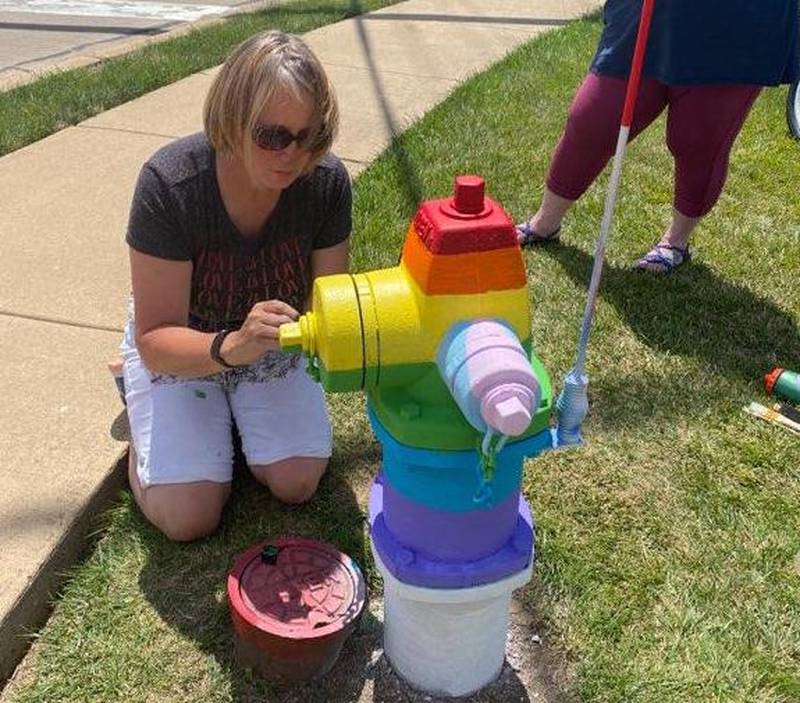Artist Chrissy Swanson repainted the Art on Fire hydrant in Geneva with pride and transgender colors after it was defaced again over the weekend.