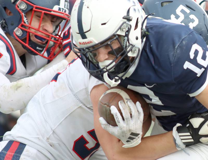 Cary-Grove’s Landon Barnett looks for running room against  Belvidere North in IHSA Class 6A quarterfinal playoff football action on Saturday, Nov. 16, 2024, at Al Bohrer Field on the campus of Cary-Grove High School in Cary.