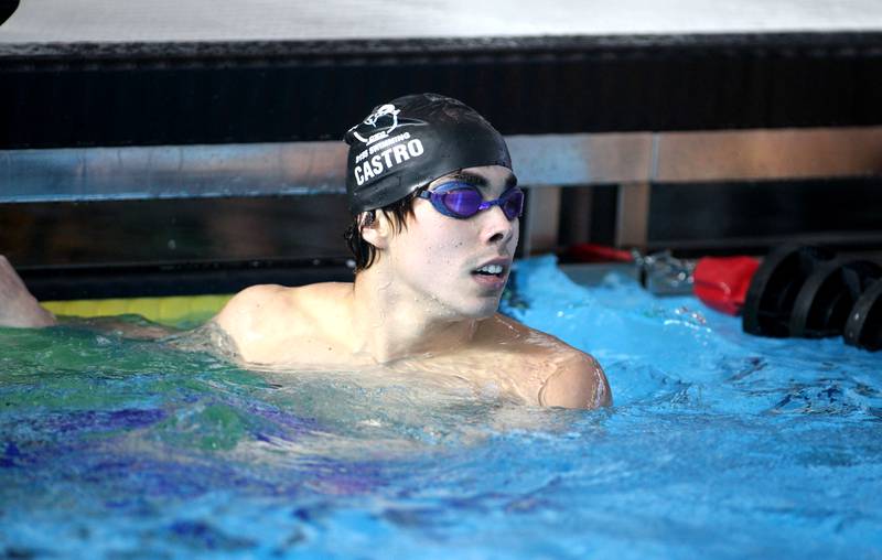 Cary-Grove’s Ben Castro looks at his time following the championship heat of the 100-yard butterfly during the IHSA Boys Swimming and Diving Championships at FMC Natatorium in Westmont on Saturday, Feb. 26. 2022.
