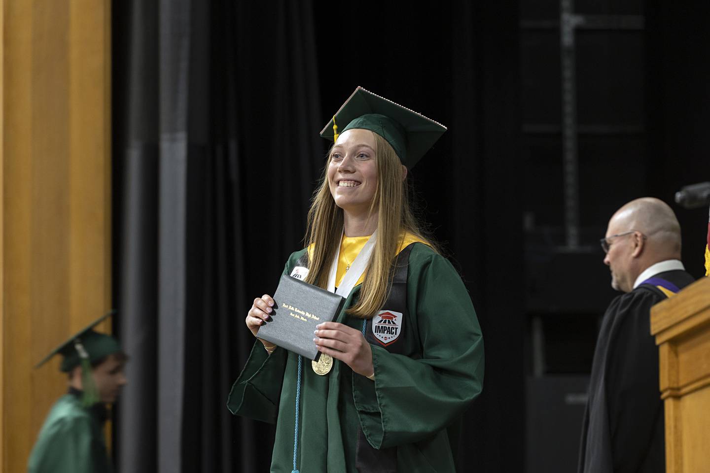 RFHS class of 2026 salutatorian Kayla Hackbarth shows off her diploma Sunday, May 17, 2026, during Rock Falls High School’s commencement.
