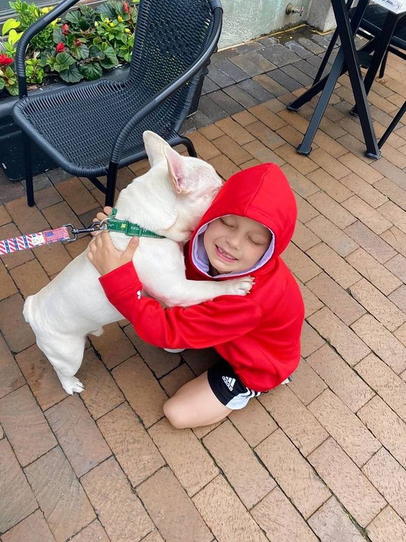 Eight-year-old Cooper Roberts, shot in the chest at Monday's Highland Park parade, asked to see his dog George after waking in the hospital.
