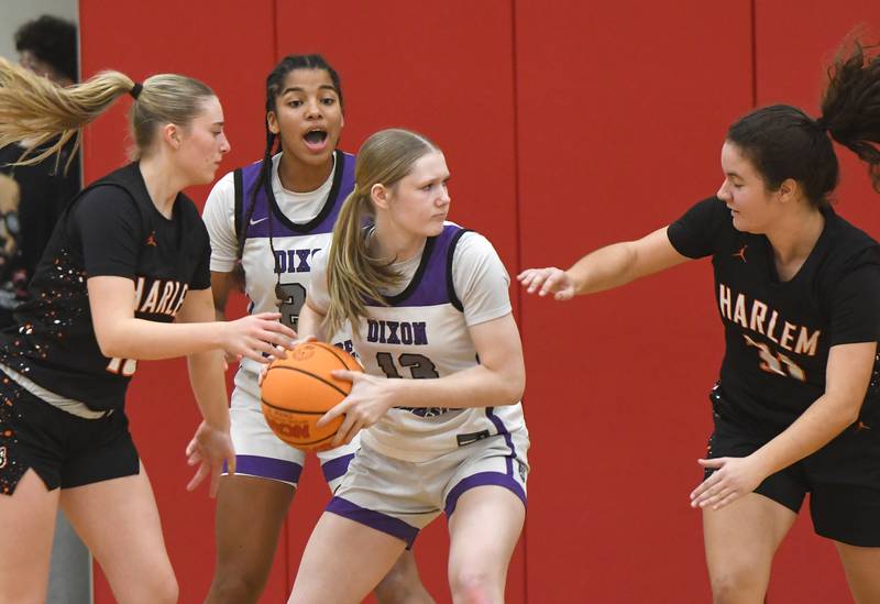 Dixon's Sophia Wendt (13) looks to pass against Harlem at the Oregon Girls Tip-Off Tournament on Wednesday, Nov. 19, 2025 at the Blackhawk Center in Oregon.