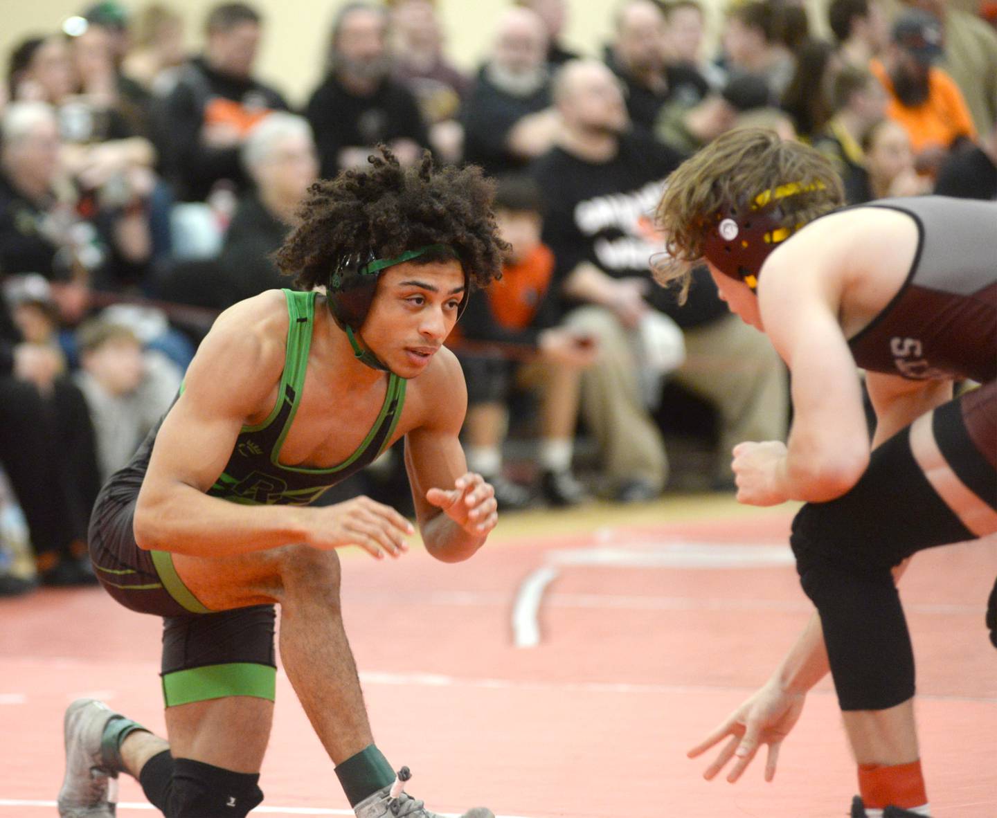 Rock Falls’ Adan Oquendo (left) prepares to battle Rockridge’s Clayton Blumenstein at 126 pounds at the 1A Oregon Sectional on Saturday, Feb. 15, 2025.