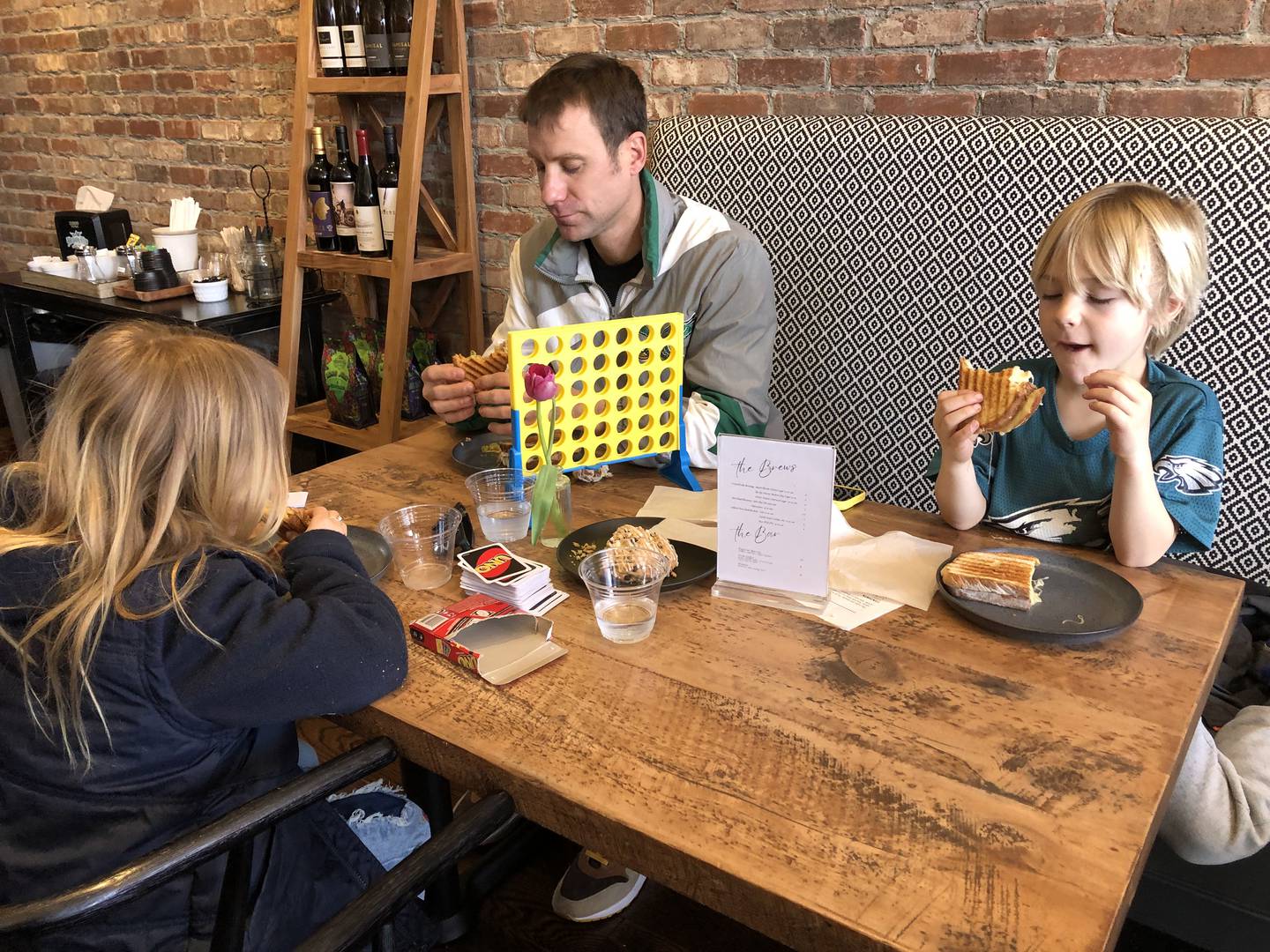 Michael Kivland eats lunch with his children, Jozie and Julian, March 28, 2024 at Lincoln House in Huntley.