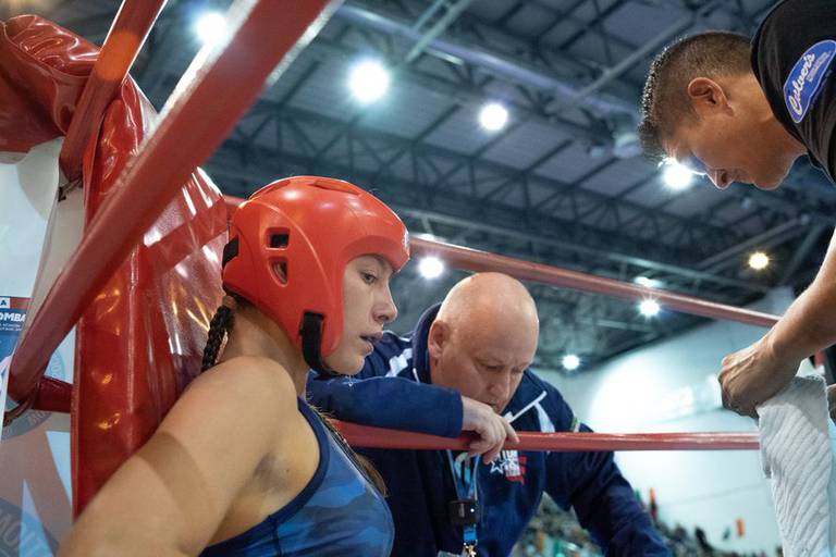 Marengo High School senior Cheyenne Welker, shown here with her coach, Rob Zbilski, center, won the bronze medal in her division at the WAKO Junior World Championships Oct. 3-9, 2022, in Italy.