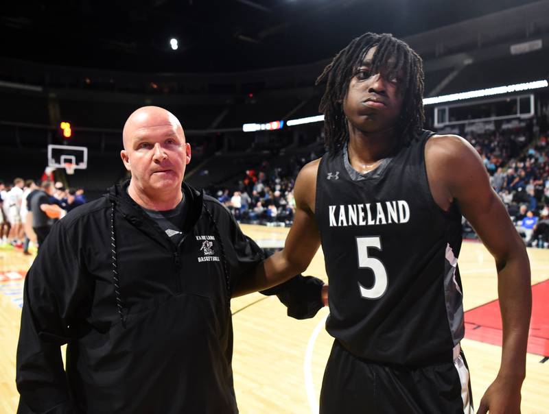 Kaneland's Freddy Hassan heads to the locker room after hugging head coach Ernie Colombe after the Knights’ 68-28 loss to DePaul College Prep during the Class 3A boys supersectional at NOW Arena on Monday, March 10, 2025 in Hoffman Estates.