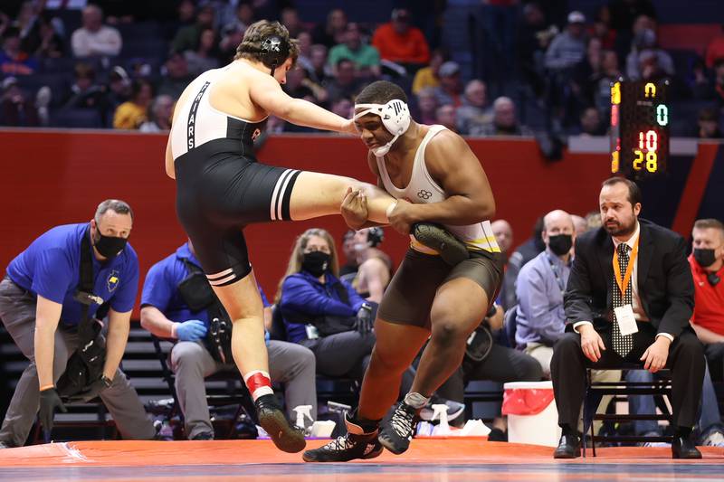 Joliet Catholic’s Dillan Johnson looks to drop Fenwick’s Jimmy Liston in the Class 2A 285lb. championship match at State Farm Center in Champaign. Saturday, Feb. 19, 2022, in Champaign.