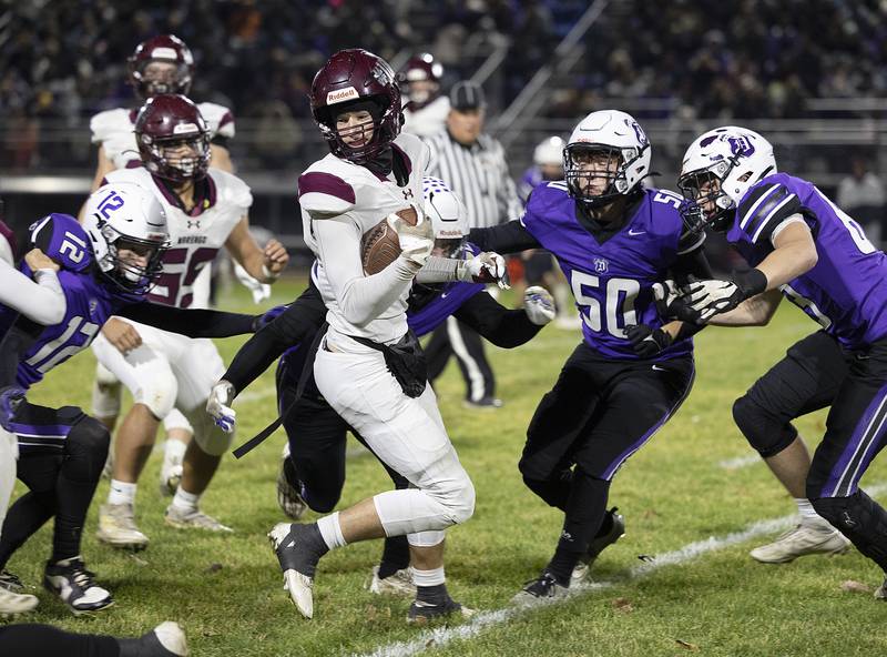 Marengo’s Gavin Bards looks for running room against Dixon Friday, Nov. 1, 2024 in the 4A football playoffs in Dixon.
