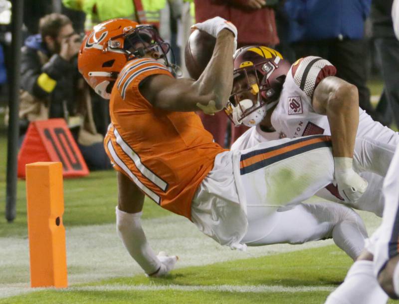 Chicago Bears wide receiver Darnell Mooney (11) fails to score a touchdown on this catch late in the fourth quarter as Washington Commanders corner back Benjamin St.-Juste makes the tackle on Thursday, Oct. 13, 2022 at Soldier Field.