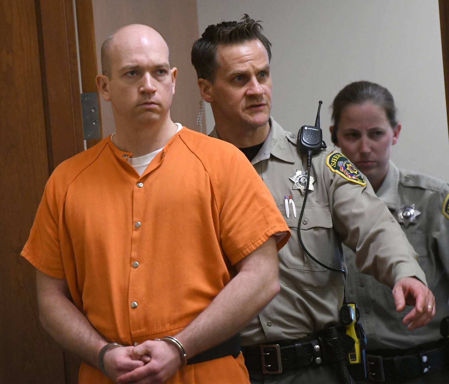 Matthew Plote, 34, of Malta, in escorted into an Ogle County courtroom on Friday afternoon. He is charged with the 2020 murders of Melissa Lamesch and her unborn child. Both were found dead in the Lamesch home in Mt. Morris after a Nov. 25, 2020, fire.