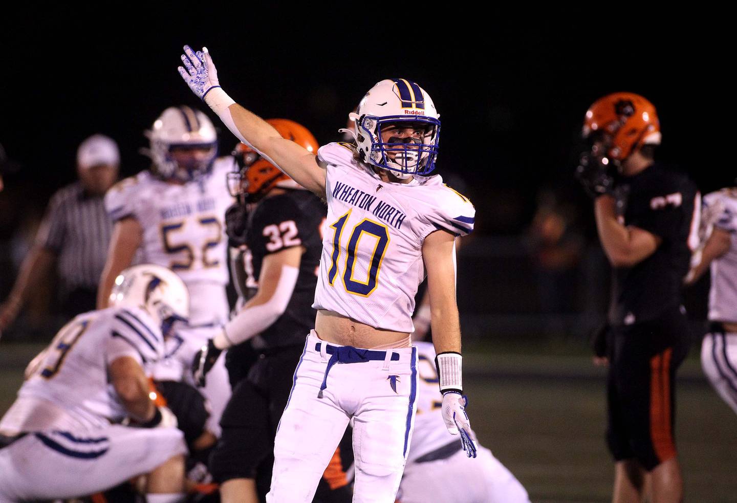 Wheaton North's Tyler O'Connor (10) celebrates a turnover during a game at Wheaton Warrenville South on Friday, Oct. 8, 2021.