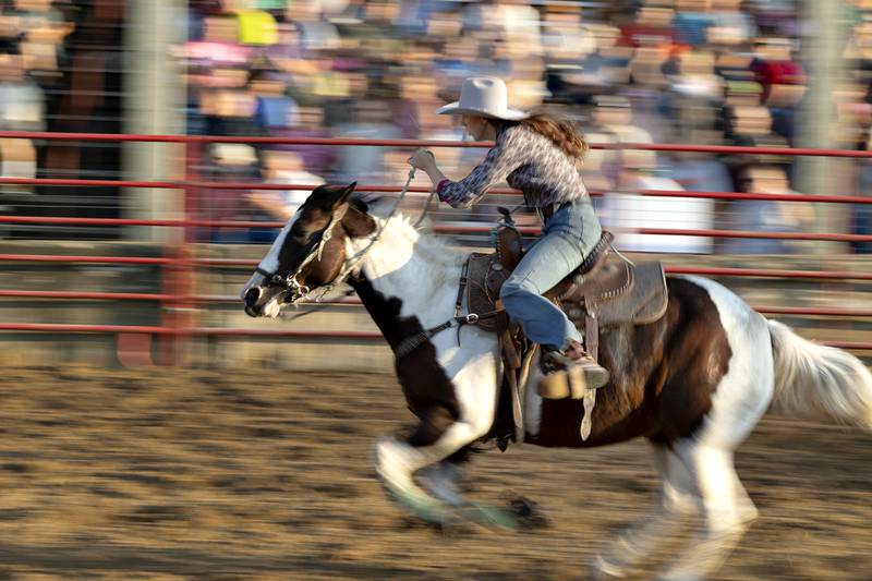 Quincy Hochstatter competes in the barrel racing event Thursday, August 7, 2025, at Carroll County Fair’s T and A Bucking Bulls Rodeo.