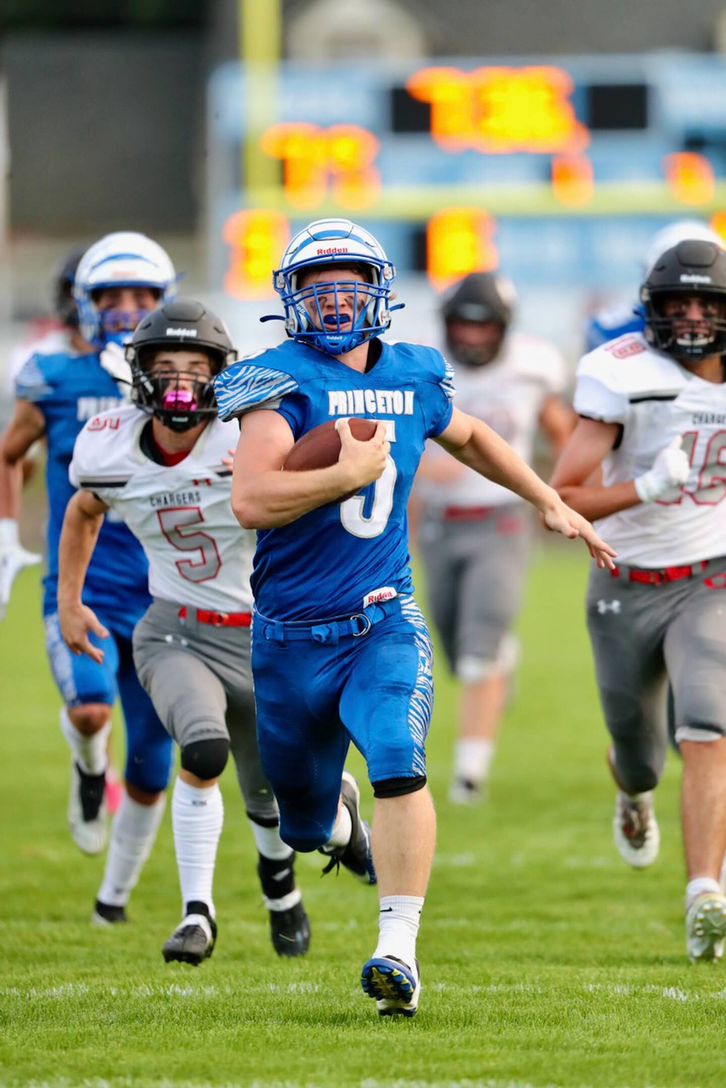 Princeton senior CJ Hickey breaks away for a 40-yard touchdown against Orion Thursday night at Bryant Field. The Tigers won 60-20.